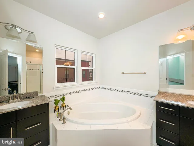 a bathroom with a bathtub and a sink
