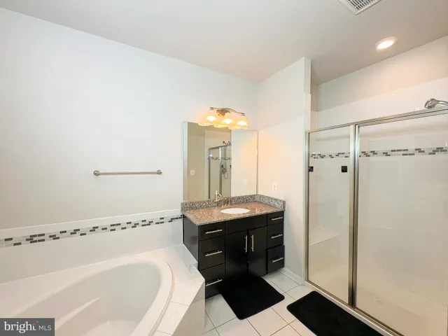 a bathroom with a bathtub and a sink