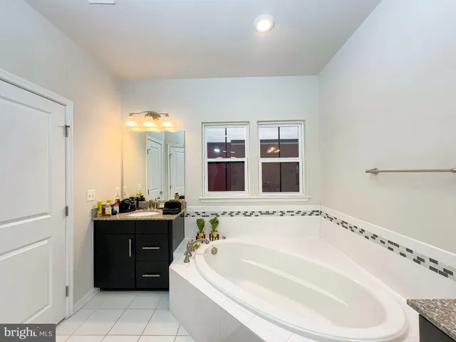 a bedroom with a bed and flat screen tv