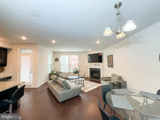 a living room with furniture fireplace and a flat screen tv