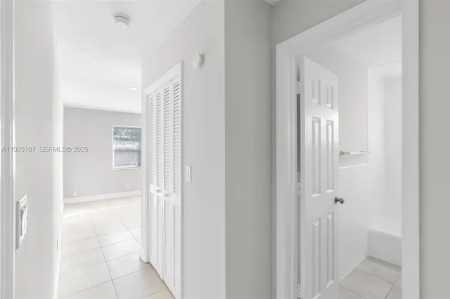 a view of a bathroom from a hallway