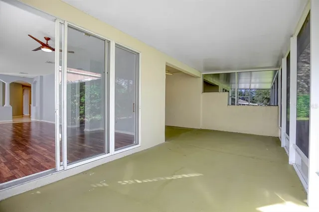 a view of an empty room with glass door