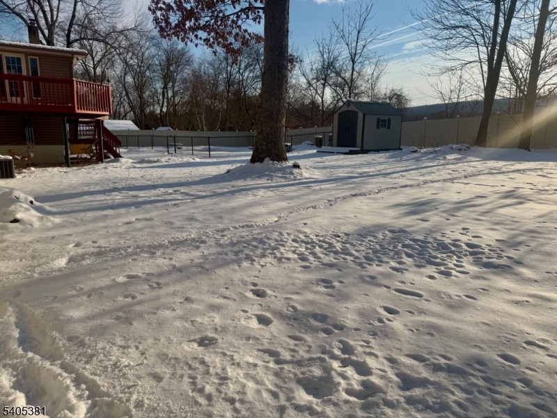 9 Windsor Drive Oak Ridge, NJ 07438 - Photo 11 of 50 a view of road with covered with snow
