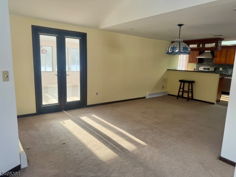 9 Windsor Drive Oak Ridge, NJ 07438 - Photo 18 of 50 a view of a room with a cabinet and mirrors