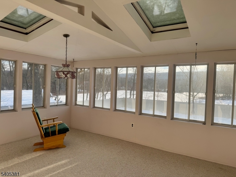9 Windsor Drive Oak Ridge, NJ 07438 - Photo 19 of 50 a room with furniture and windows