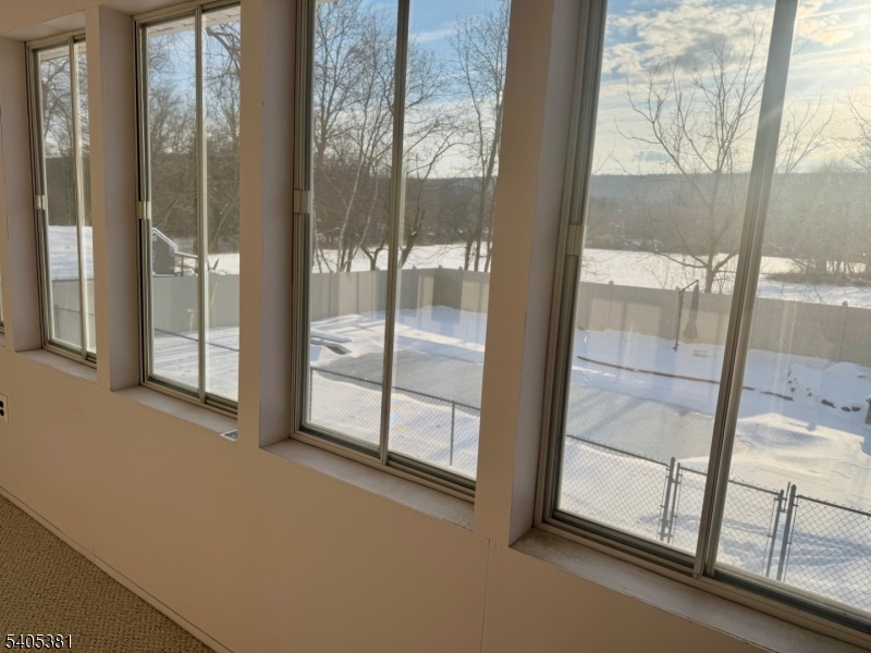 9 Windsor Drive Oak Ridge, NJ 07438 - Photo 20 of 50 a view of an empty room and window