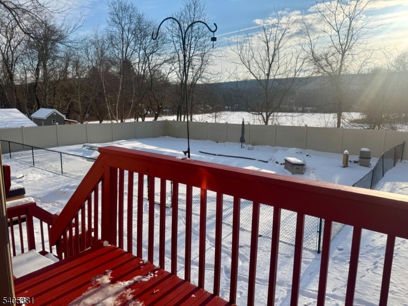9 Windsor Drive Oak Ridge, NJ 07438 - Photo 22 of 50 a view of a porch with a yard