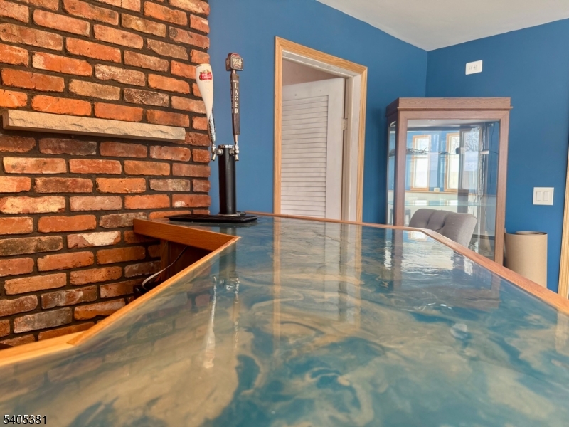 9 Windsor Drive Oak Ridge, NJ 07438 - Photo 41 of 50 a view of entryway and hall with wooden floor