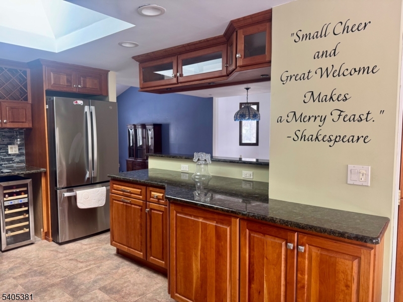 9 Windsor Drive Oak Ridge, NJ 07438 - Photo 49 of 50 a kitchen with stainless steel appliances granite countertop a refrigerator and a sink