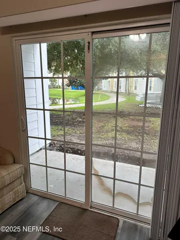 a bedroom with furniture and a flat screen tv