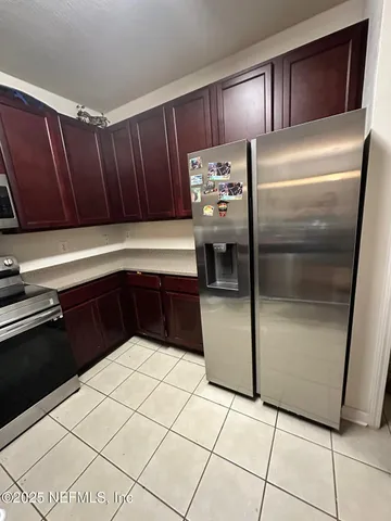 a kitchen with stainless steel appliances a refrigerator and a sink
