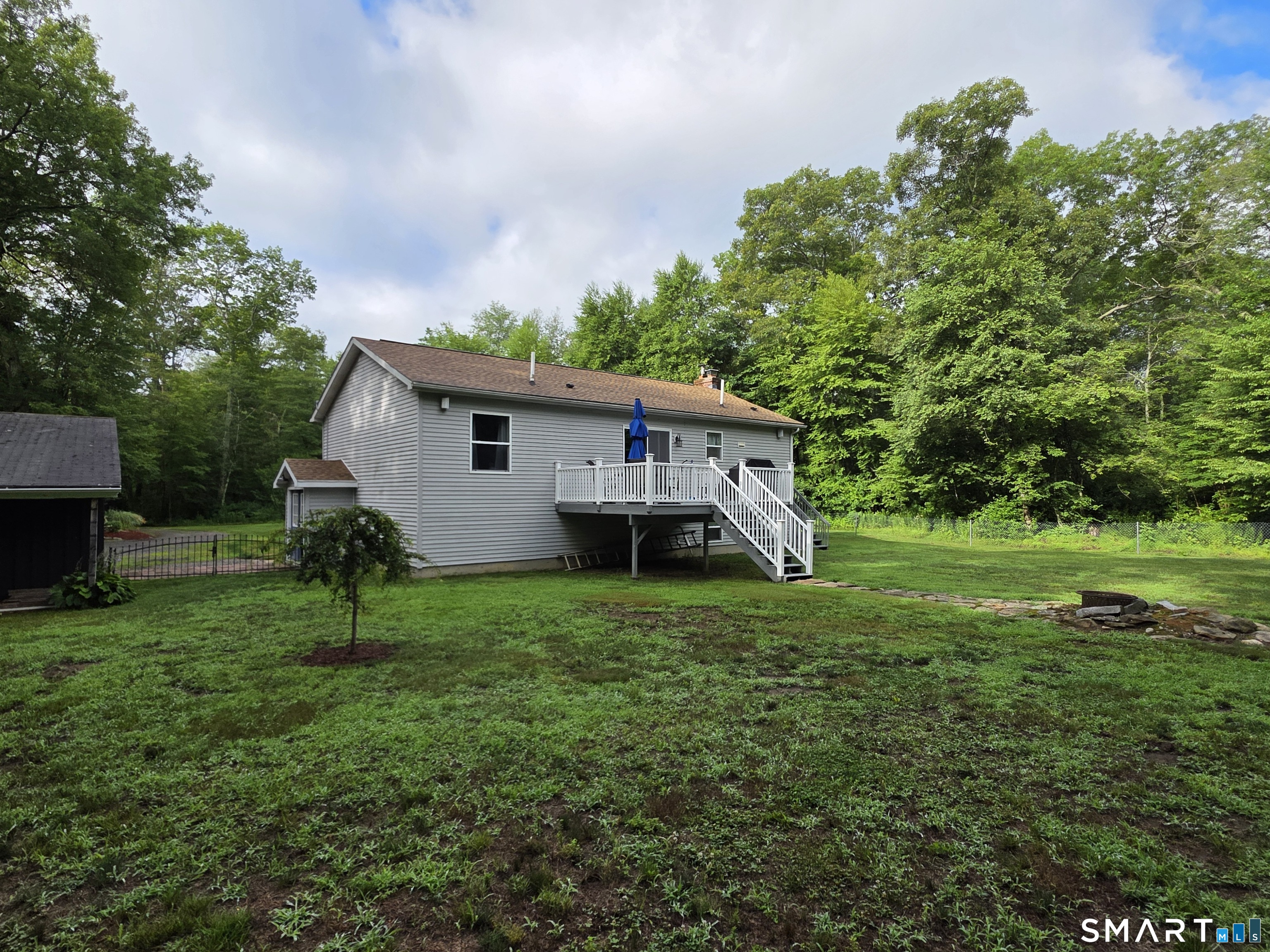 29 Bingham Road Canterbury, CT 06331 - Photo 40 of 40 a view of a house with a yard and sitting area