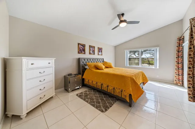 a bedroom with a bed and a cabinets