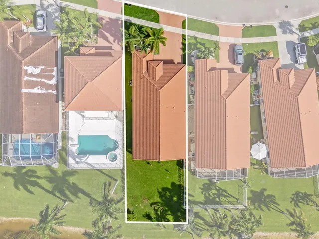 a view of a backyard with swimming pool