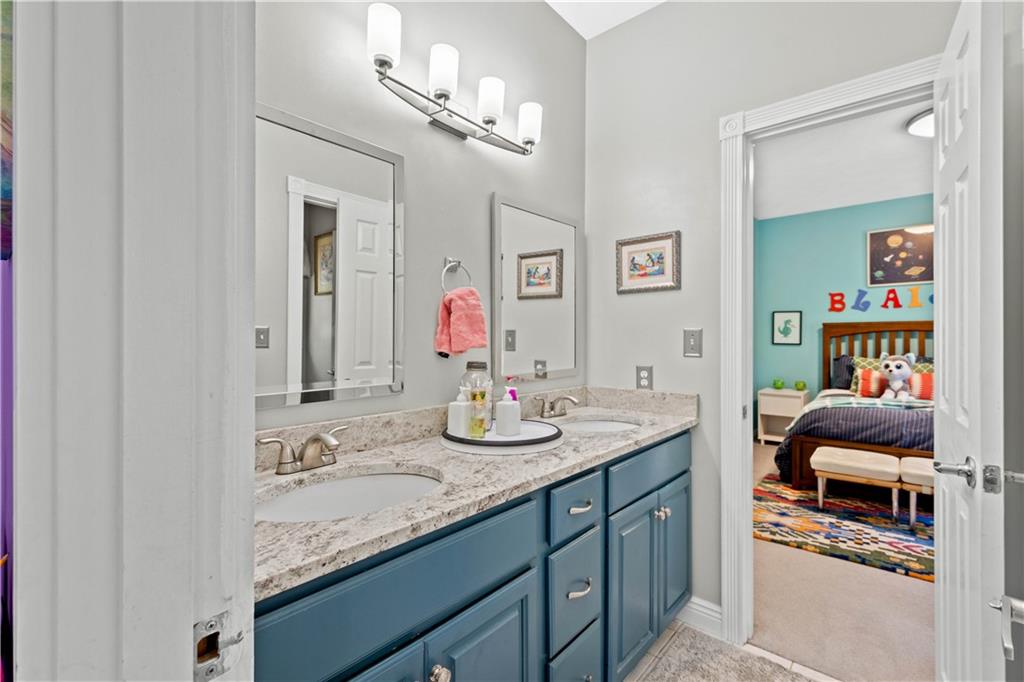 102 Lantern Circle McMurray, PA 15317 - Photo 15 of 25 a en suite bathroom with a granite countertop sink and a mirror