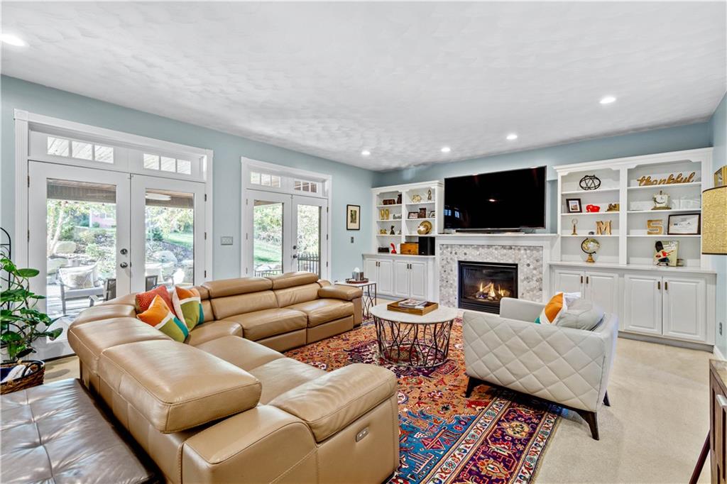 102 Lantern Circle McMurray, PA 15317 - Photo 8 of 25 a living room with furniture fireplace and a flat screen tv