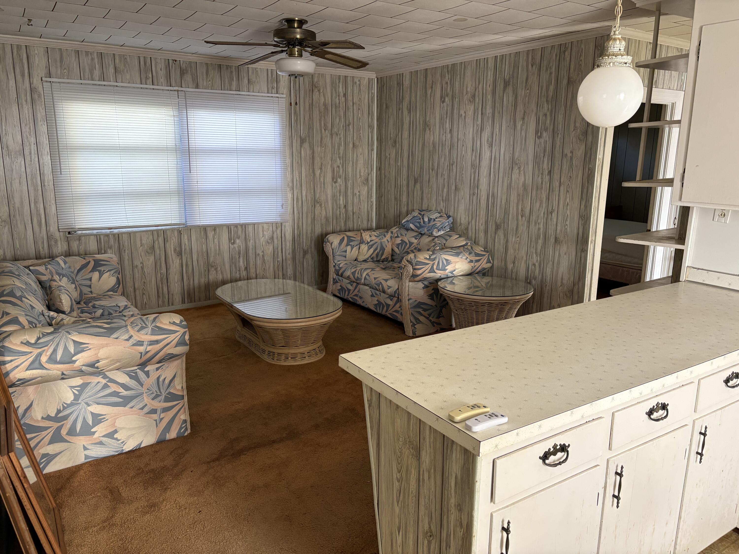 197 Cobb Road Panama City Beach, FL 32413 - Photo 11 of 18 a living room with furniture and window