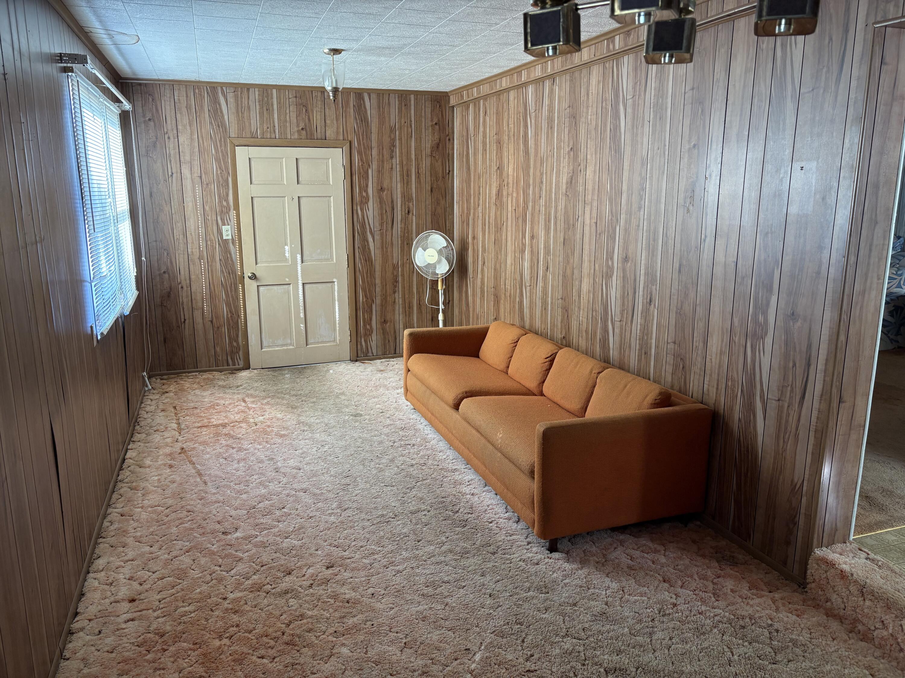 197 Cobb Road Panama City Beach, FL 32413 - Photo 15 of 18 a living room with furniture and a window