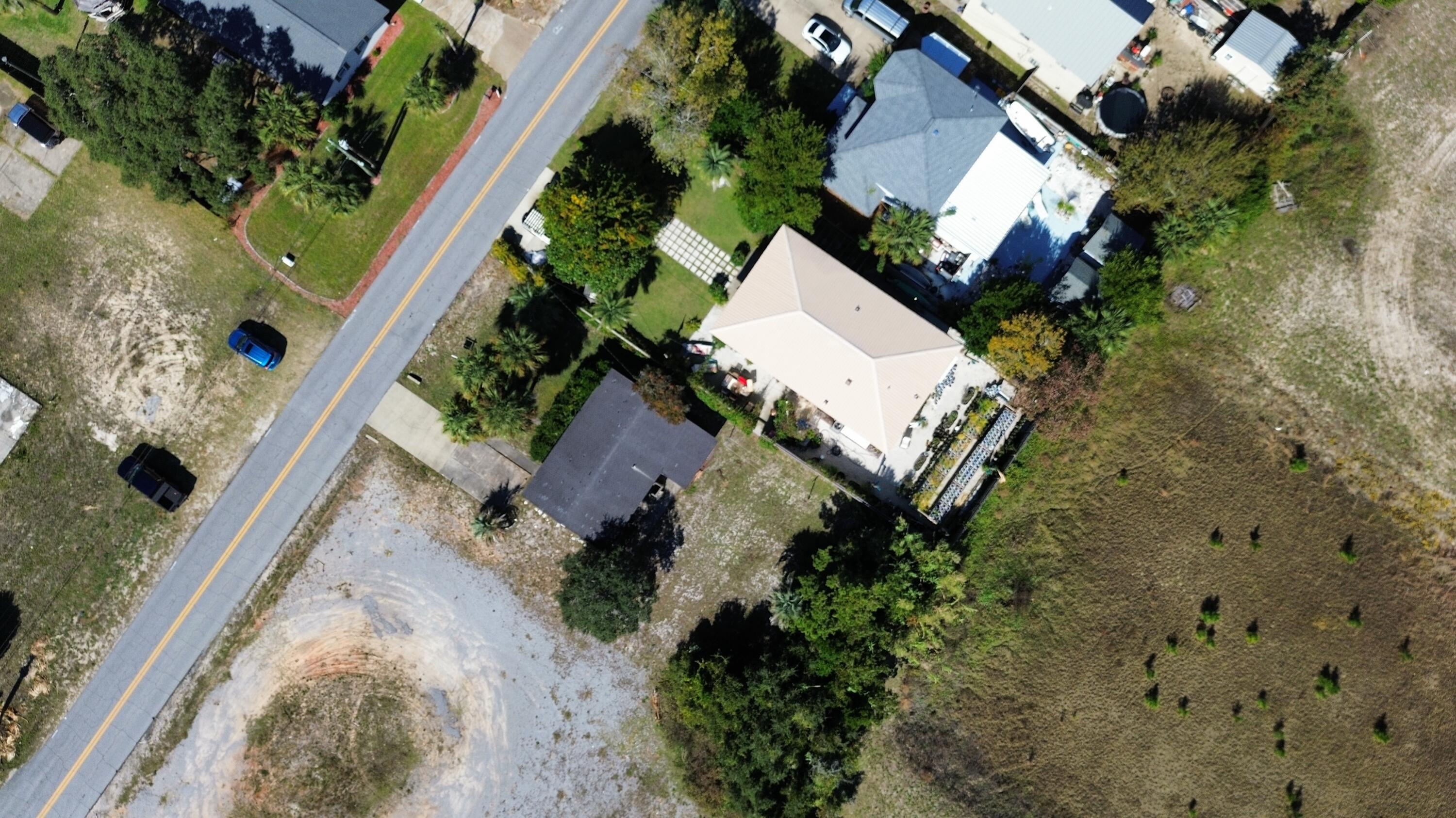 197 Cobb Road Panama City Beach, FL 32413 - Photo 8 of 18 an aerial view of a house with a yard