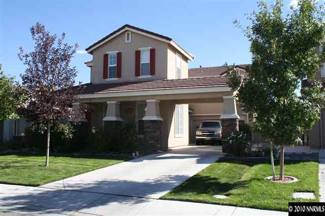 9130 Hummer Drive Reno, NV 89521 - Photo 1 of 11 a front view of a house with a yard
