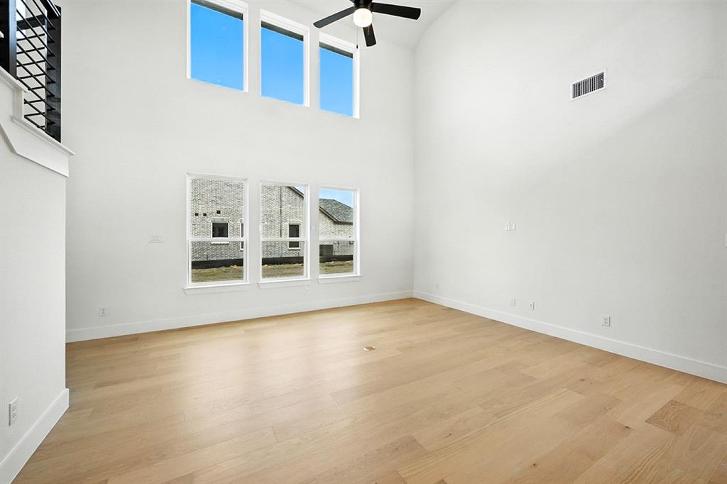 4520 Script Street Prosper, TX 75078 - Photo 13 of 27 a view of a room with a wooden floor and a window