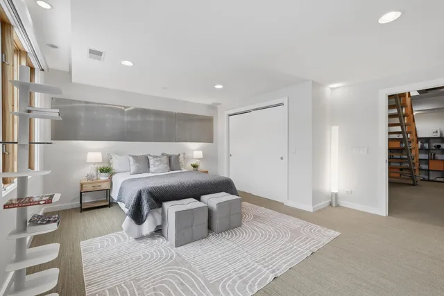 a bedroom with a bed and gym equipment