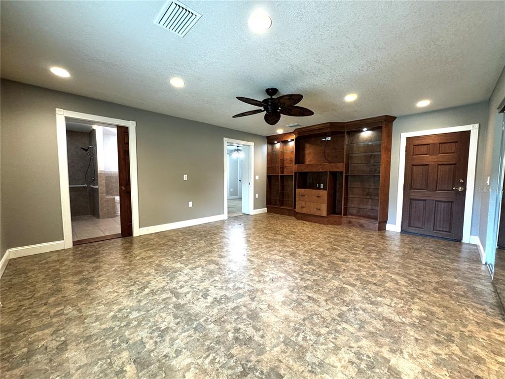 3419 Pearson Road Valrico, FL 33596 - Photo 14 of 20 a view of a livingroom with a chandelier fan and windows