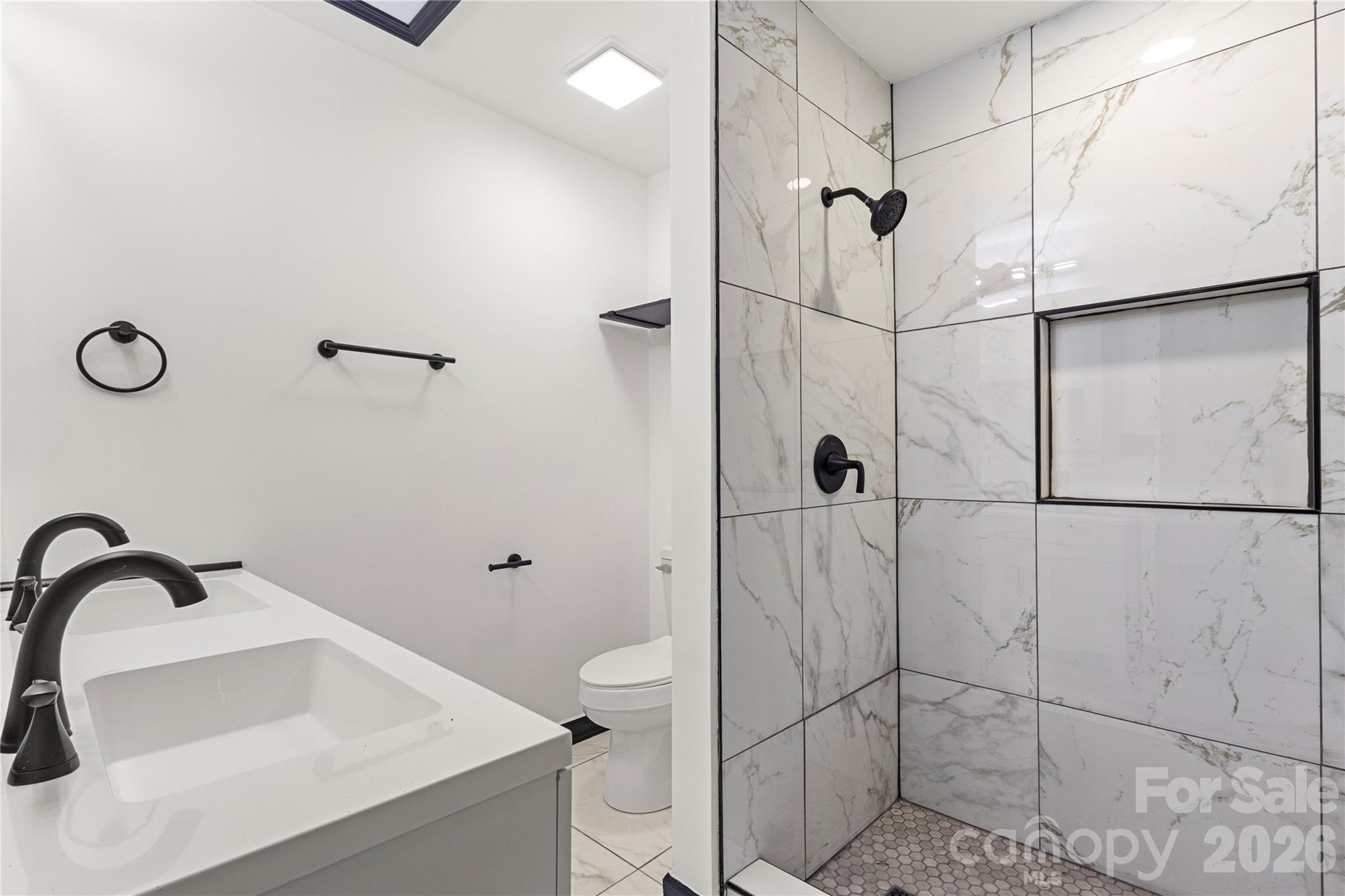 110 Courtland Street Chester, SC 29706 - Photo 17 of 22 a bathroom with a sink toilet and shower