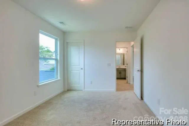 a bathroom with a toilet and a bath tub