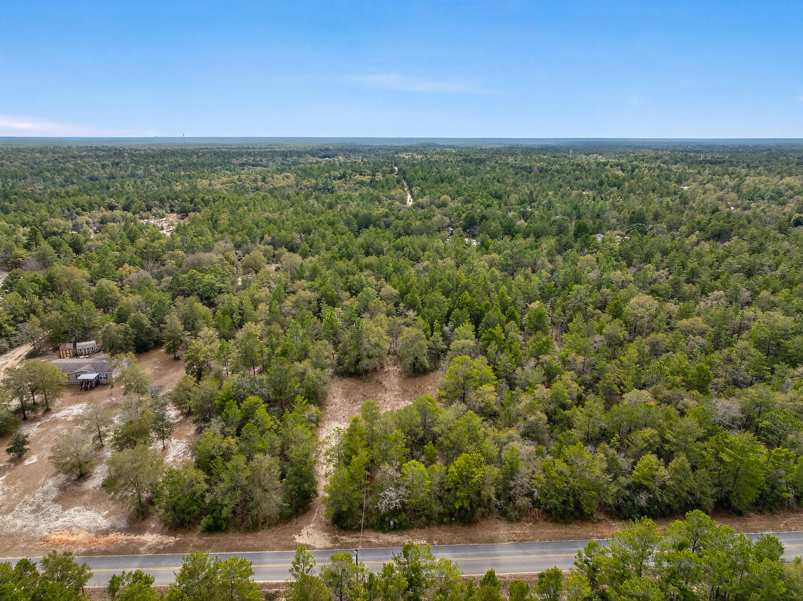610 Spring Hill Road DeFuniak Springs, FL 32433 - Photo 13 of 20 a view of a lake with a city