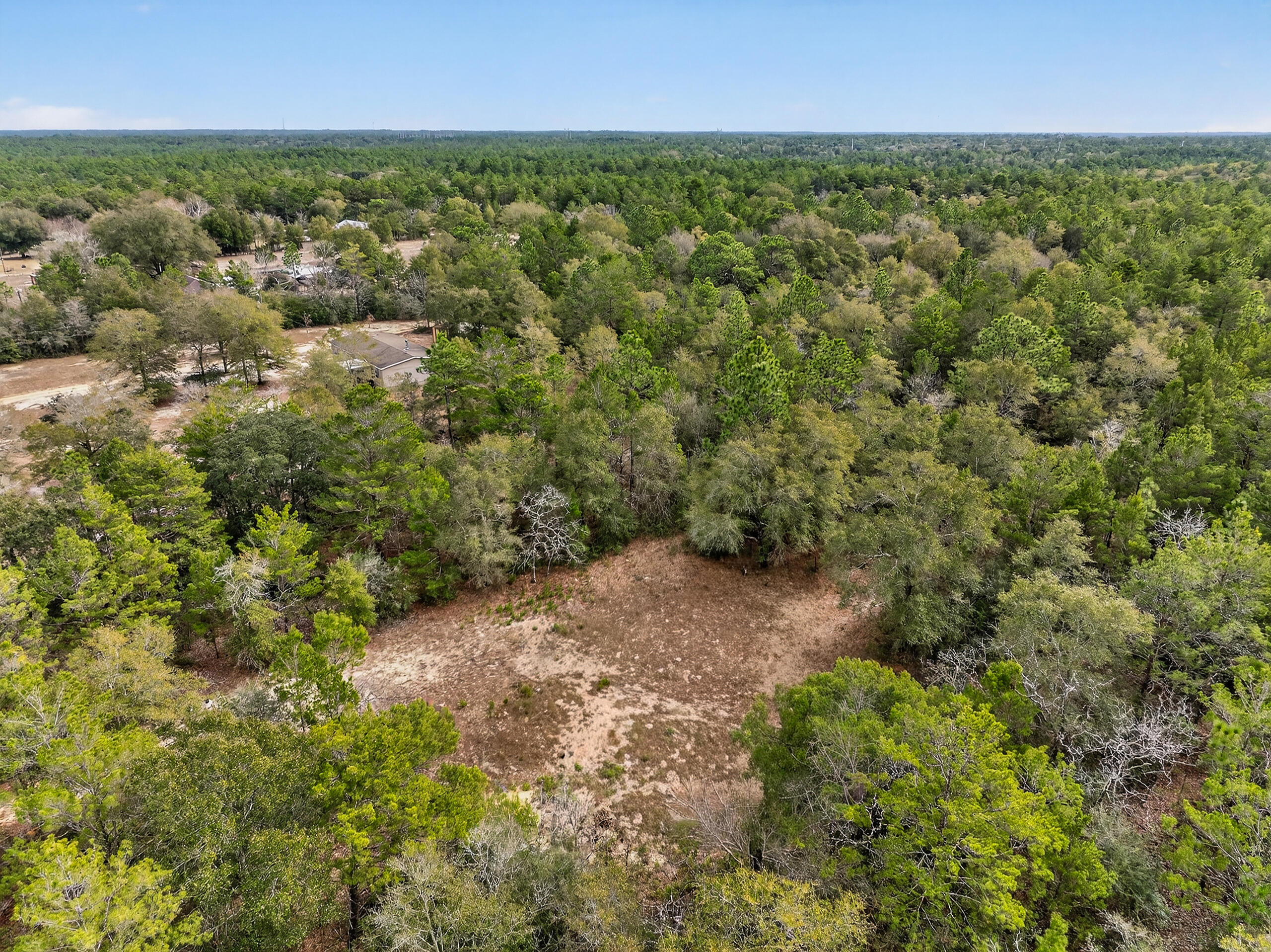 610 Spring Hill Road DeFuniak Springs, FL 32433 - Photo 17 of 20 an aerial view of residential houses with outdoor space and trees