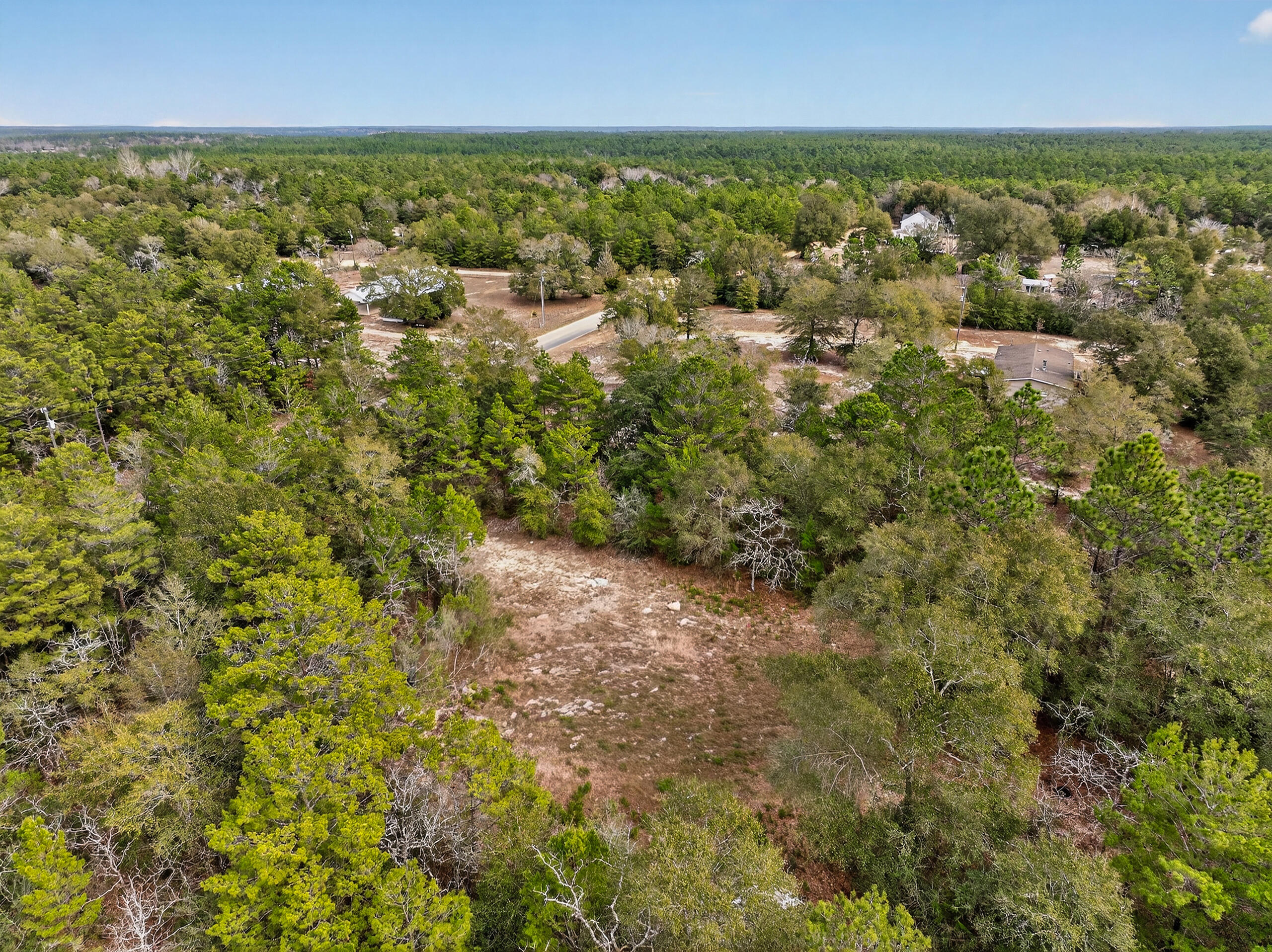 610 Spring Hill Road DeFuniak Springs, FL 32433 - Photo 18 of 20 an aerial view of residential houses with outdoor space and trees