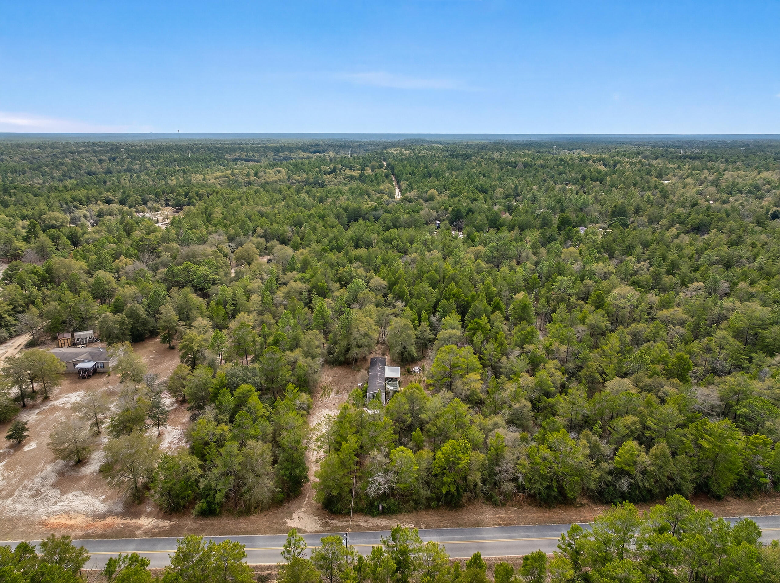 610 Spring Hill Road DeFuniak Springs, FL 32433 - Photo 4 of 20 a view of a field with an ocean