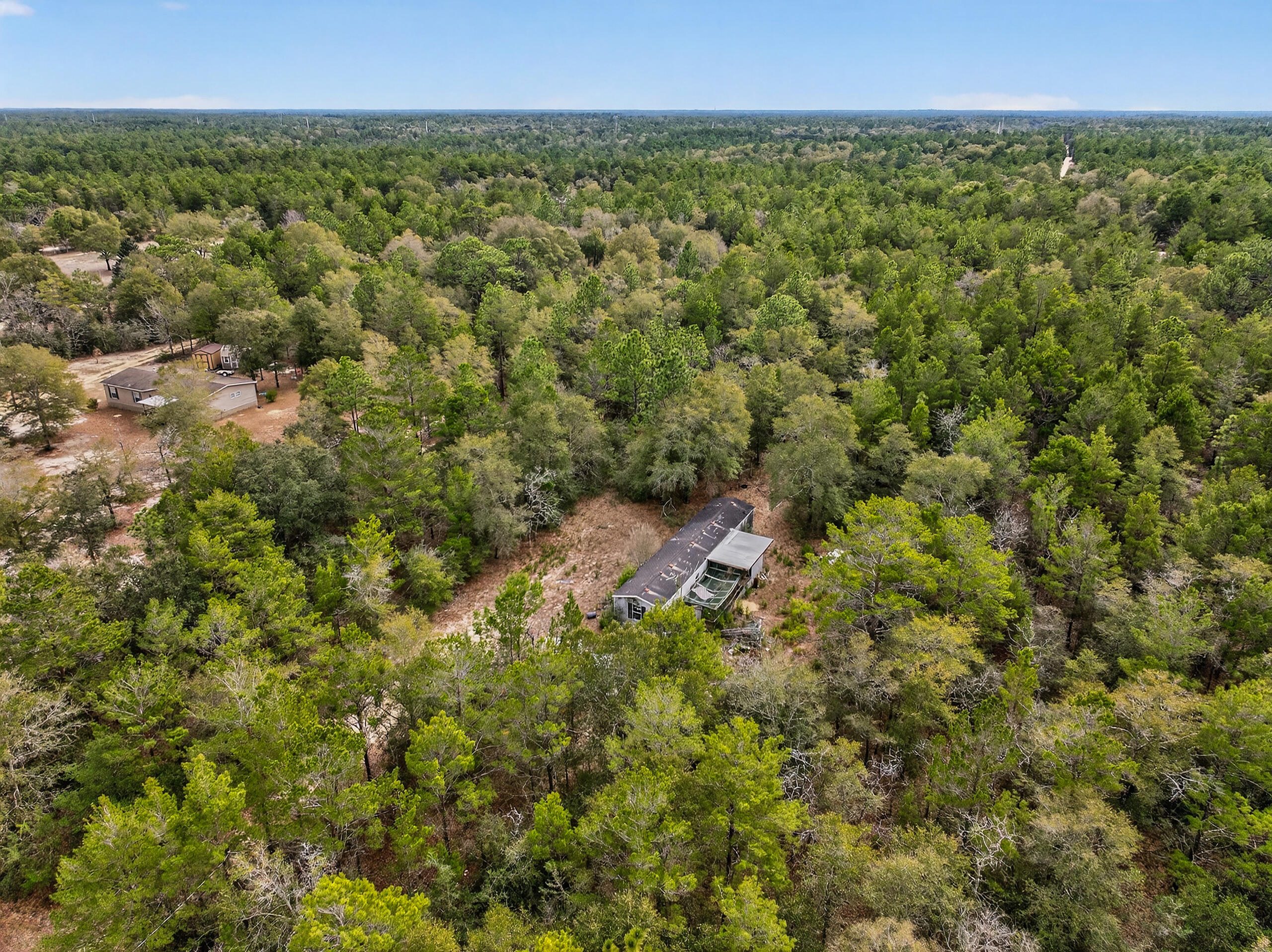 610 Spring Hill Road DeFuniak Springs, FL 32433 - Photo 7 of 20 a view of a green field with lots of bushes