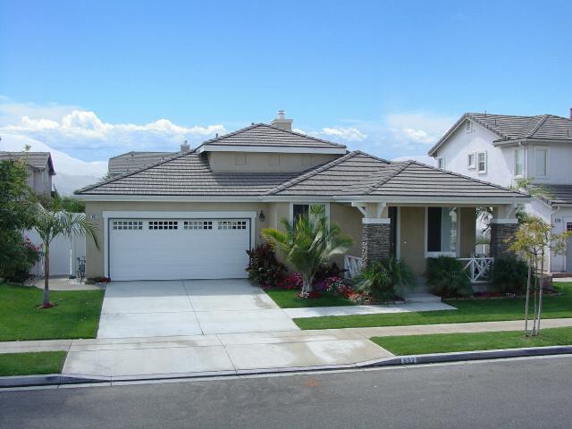 892 Union Pacific Street Fillmore, CA 93015 - Photo 1 of 3 a front view of a house with a garden and plants