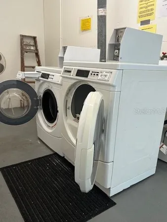 a utility room with dryer and washer