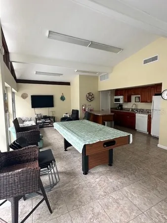 a room with lots of furniture and view of living room