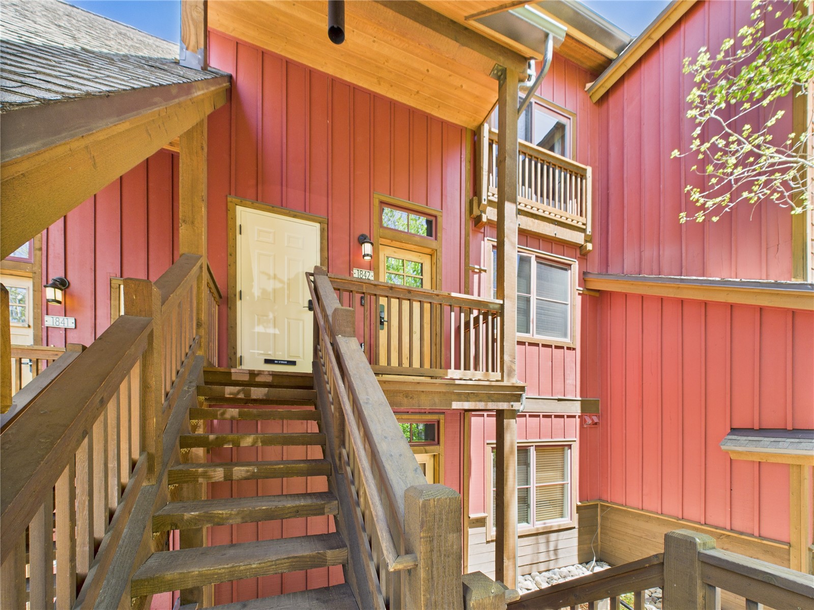 27 Lake Ridge Circle, Unit 1842 Keystone, CO 80435 - Photo 3 of 50 Covered stairway leads to your top-floor end unit with a welcoming front porch.