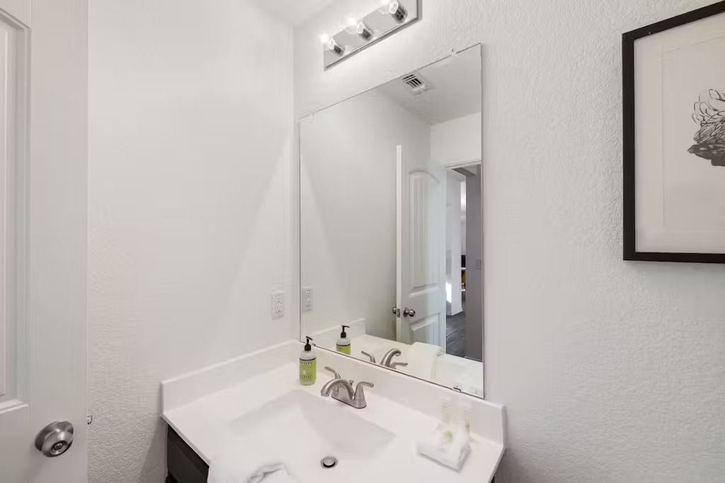 3609 Batson Drive Austin, TX 78725 - Photo 11 of 33 Bathroom featuring a textured wall and vanity