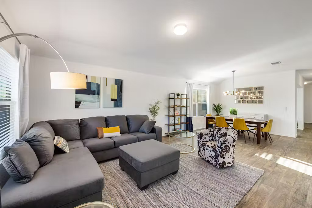 3609 Batson Drive Austin, TX 78725 - Photo 13 of 33 Living area with wood finished floors and a chandelier