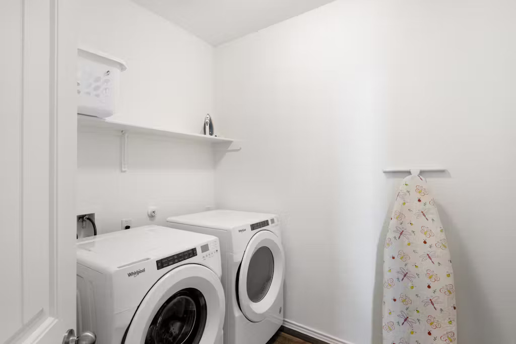 3609 Batson Drive Austin, TX 78725 - Photo 19 of 33 Washroom with washing machine and dryer and baseboards