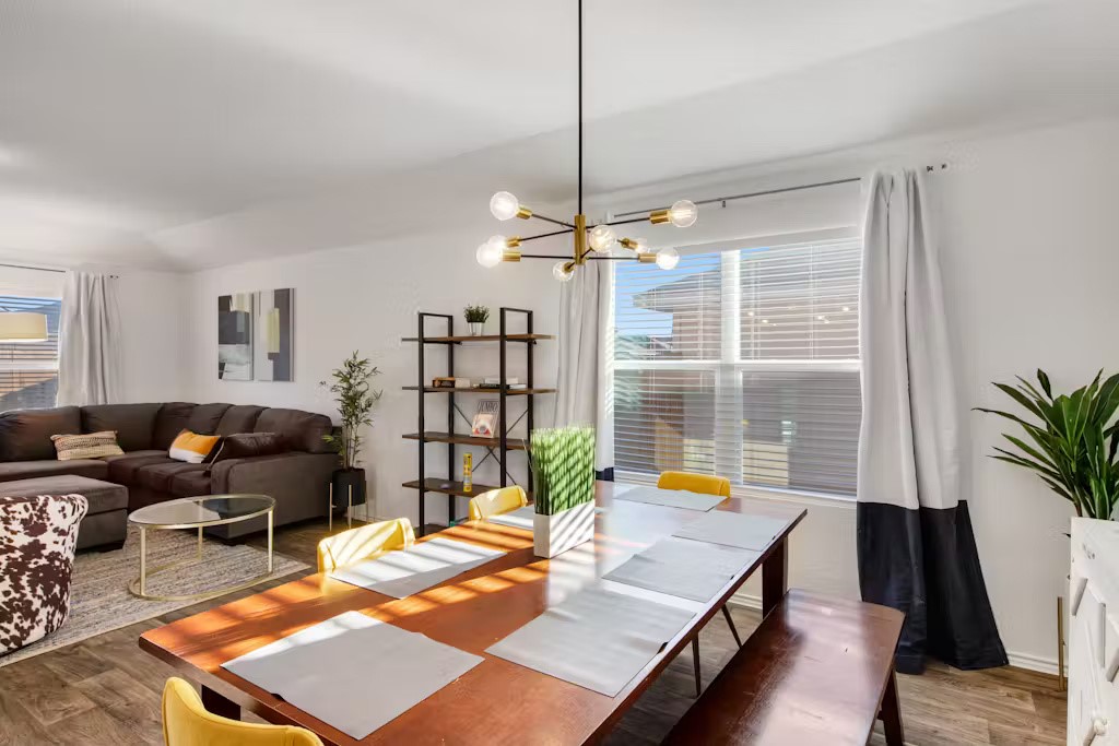 3609 Batson Drive Austin, TX 78725 - Photo 23 of 33 Dining area with wood finished floors, a chandelier, and plenty of natural light