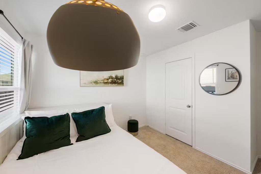 3609 Batson Drive Austin, TX 78725 - Photo 25 of 33 Bedroom with light colored carpet and baseboards