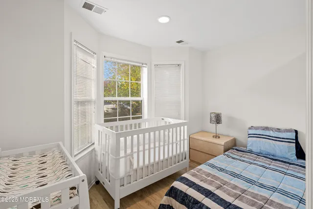 a bedroom with furniture and a window