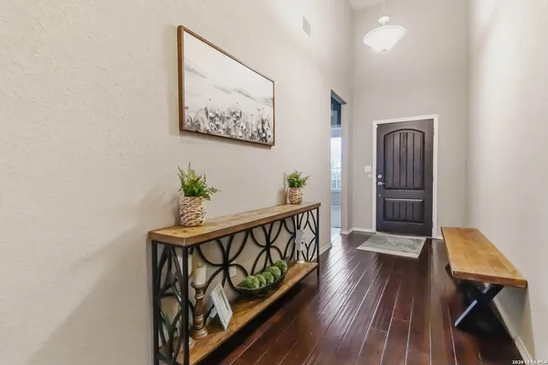 a view of entryway with wooden floor