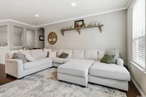 a living room with a couch and a window