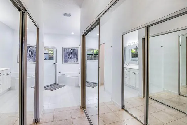 a bathroom with a shower and a glass door