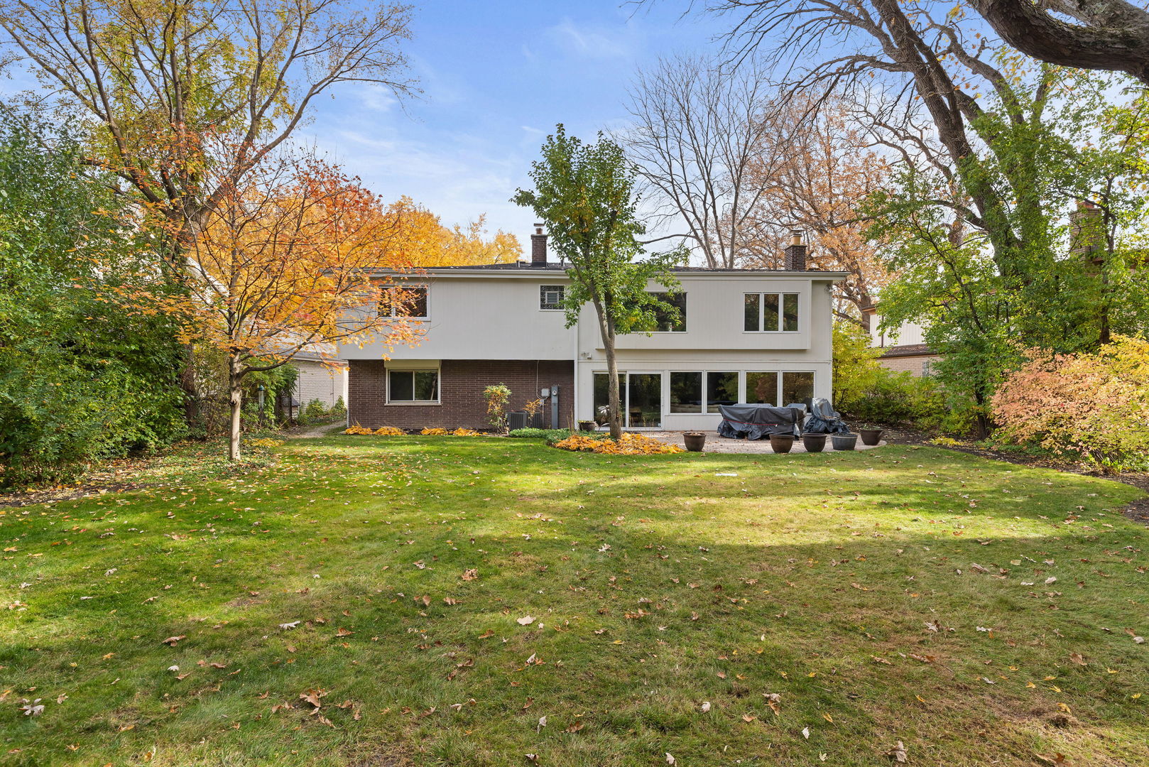 1736 Cavell Avenue Highland Park, IL 60035 - Photo 4 of 29 a front view of a house with swimming pool having outdoor seating