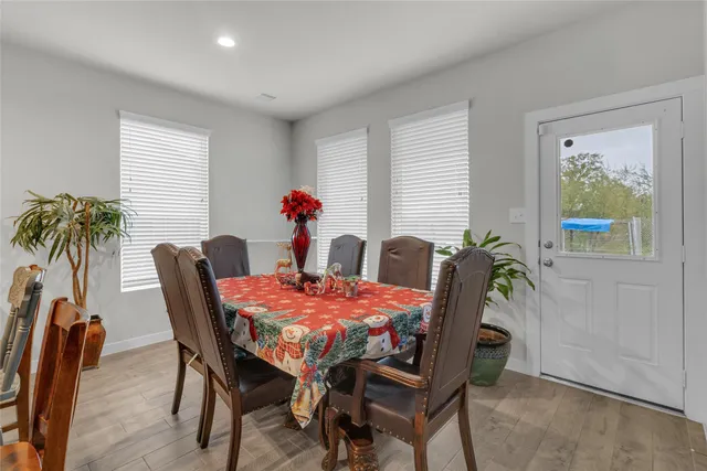 a dining room with furniture and window