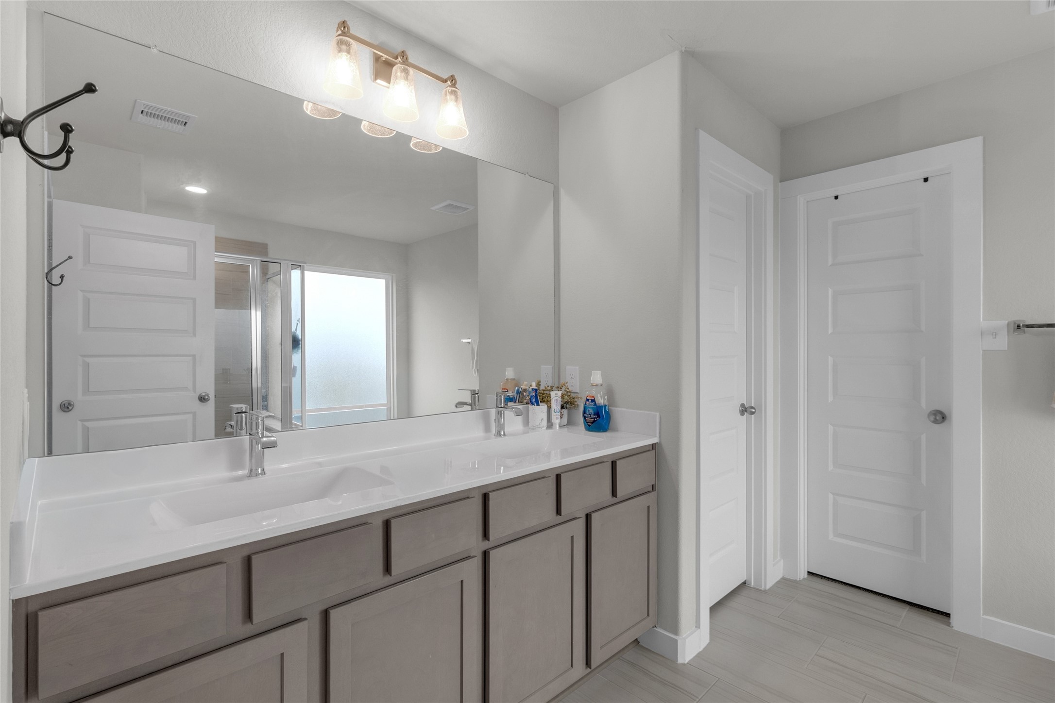 2314 Village Side Trail Rosenberg, TX 77471 - Photo 20 of 31 a bathroom with a sink and a mirror